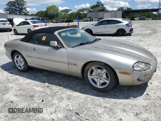 1999 Jaguar XK z VIN SAJGX2049XC034022, wystawiony jako Copart lot #55690025 z przebiegiem Nie podano mil oraz Tytuł czysty. Historia ofert i sprzedaży dostępna na DreamBid. Obrazek 4.