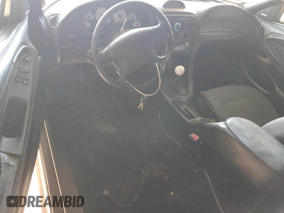 1997 Ford Mustang Cobra with VIN 1FALP47V8VF103811, listed as a Copart auction lot 56455324 with 129,499 mi miles and Salvage Title. Bid and sale history available at carsss.com. Image 8.