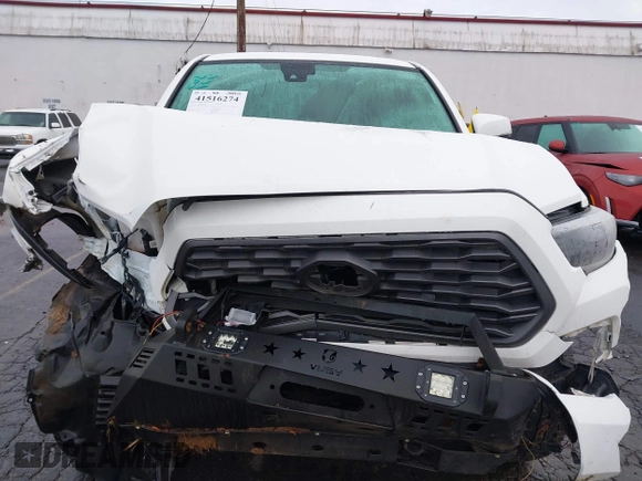 2021 Toyota Tacoma SR5 with VIN 3TMDZ5BN1MM100575, listed as a IAAI auction lot 41516274 with 61,974 mi miles and . Bid and sale history available at DreamBid. Image 13.