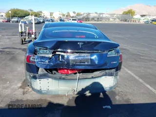 2014 Tesla Model S 60 with VIN 5YJSA1H14EFP57209, listed as a IAAI auction lot 41305157 with 141,364 mi miles and . Bid and sale history available at DreamBid. Image 6.