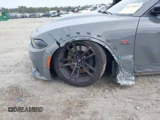2023 Dodge Charger Scat Pack Widebody with VIN 2C3CDXGJ6PH646050, listed as a IAAI auction lot 41175513 with 7,684 mi miles and . Bid and sale history available at DreamBid. Image 6.