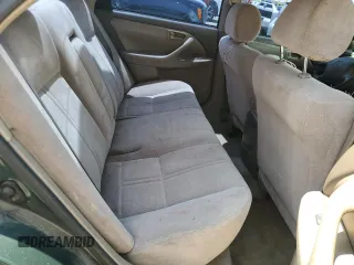 2000 Toyota Camry CE z VIN 4T1BG22K0YU708702, wystawiony jako Copart lot #56755285 z przebiegiem 318 734 mil mil oraz Szkoda całkowita • Salvage title. Historia ofert i sprzedaży dostępna na DreamBid. Obrazek 10.