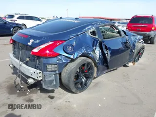 2013 Nissan 370Z z VIN JN1AZ4EH2DM380511, wystawiony jako IAAI lot #41912193 z przebiegiem Nie podano mil oraz . Historia ofert i sprzedaży dostępna na DreamBid. Obrazek 4.