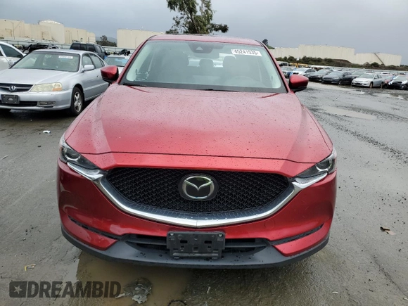 2021 Mazda CX-5 Touring with VIN JM3KFACM8M0406987, listed as a Copart auction lot 45241535 with 57,673 mi miles and Salvage Title. Bid and sale history available at carsss.com. Image 5.