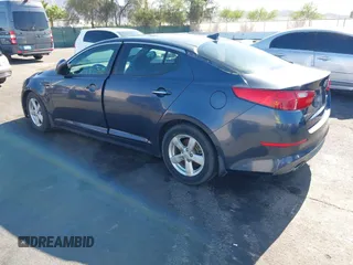 2015 Kia Optima LX z VIN KNAGM4A73F5605256, wystawiony jako IAAI lot #42459022 z przebiegiem 180 233 mil mil oraz . Historia ofert i sprzedaży dostępna na DreamBid. Obrazek 3.