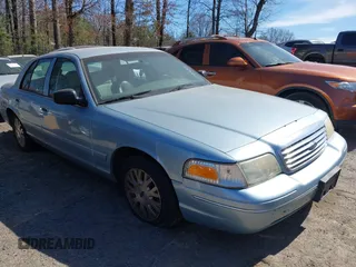 2004 Ford Crown Victoria LX z VIN 2FAFP74W64X121657, wystawiony jako IAAI lot #41715463 z przebiegiem 205 885 mil mil oraz . Historia ofert i sprzedaży dostępna na DreamBid. Obrazek 1.