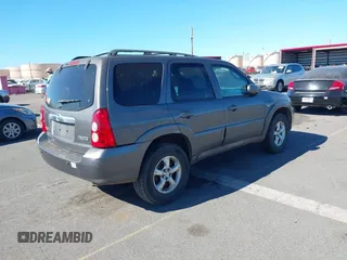 2006 Mazda Tribute S with VIN 4F2CZ04196KM12520, listed as a IAAI auction lot 41872221 with Not Provided miles and . Bid and sale history available at carsss.com. Image 4.