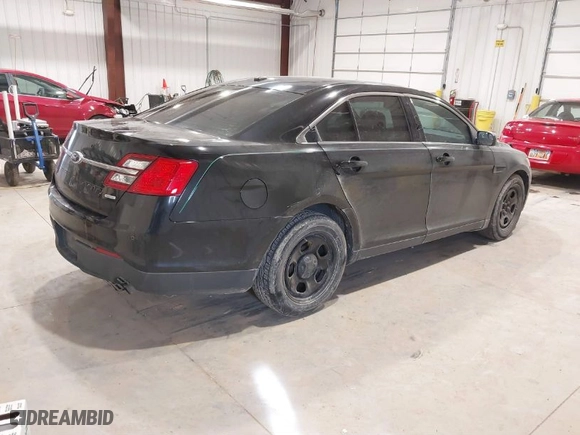 2014 Ford Sedan Police Interceptor with VIN 1FAHP2MT0EG103194, listed as a IAAI auction lot 41831070 with 186,466 mi miles. Bid and sale history available at carsss.com. Image 4.