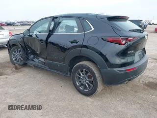 2021 Mazda CX-30 2.5 S with VIN 3MVDMAAL2MM303321, listed as a IAAI auction lot 41583346 with 57,122 mi miles. Bid and sale history available at carsss.com. Image 3.