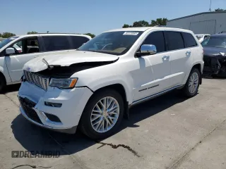 2018 Jeep Grand Cherokee Summit with VIN 1C4RJEJG9JC212554, listed as a Copart auction lot 63123065 with 82,976 mi miles and Salvage title. Bid and sale history available at DreamBid. Image 1.