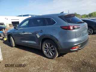 2023 Mazda CX-9 Touring z VIN JM3TCBCYXP0650893, wystawiony jako Copart lot #56875635 z przebiegiem 30 055 mil mil oraz Czysty tytuł • Clean title. Historia ofert i sprzedaży dostępna na DreamBid. Obrazek 2.