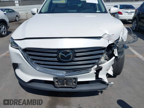 2019 Mazda CX-9 Touring with VIN JM3TCACY5K0306424, listed as a IAAI auction lot 42150466 with 95,166 mi miles and . Bid and sale history available at DreamBid. Image 12.