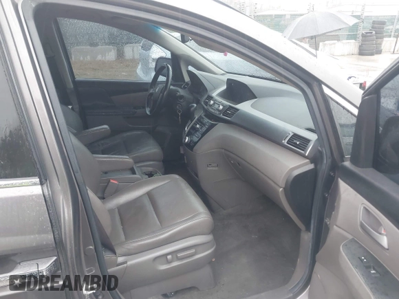 2012 Honda Odyssey EX-L with VIN 5FNRL5H6XCB057557, listed as a IAAI auction lot 42022410 with 174,286 mi miles and . Bid and sale history available at DreamBid. Image 5.