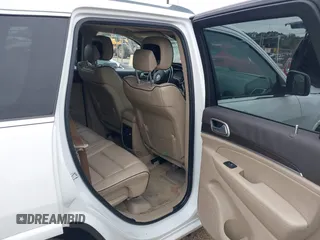2014 Jeep Grand Cherokee Overland with VIN 1C4RJECG4EC543092, listed as a IAAI auction lot 40981315 with 149,096 mi miles. Bid and sale history available at carsss.com. Image 8.