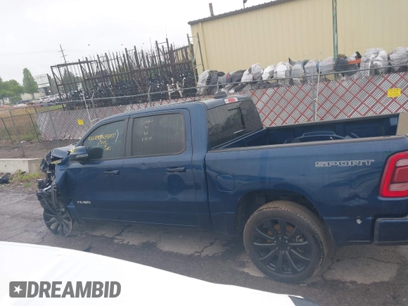2023 Ram 1500 Laramie with VIN 1C6SRFJT9PN542437, listed as a IAAI auction lot 42256410 with 5 mi miles and . Bid and sale history available at DreamBid. Image 14.