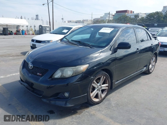 2009 Toyota Corolla XRS with VIN 1NXBE40EX9Z100623, listed as a IAAI auction lot 42032138 with 183,901 mi miles. Bid and sale history available at carsss.com. Image 2.