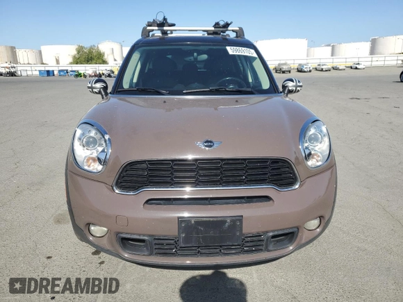 2013 MINI Countryman S ALL4 z VIN WMWZC5C51DWP30390, wystawiony jako Copart lot #59869105 z przebiegiem 111 843 mil mil oraz Szkoda całkowita • Salvage title. Historia ofert i sprzedaży dostępna na DreamBid. Obrazek 5.