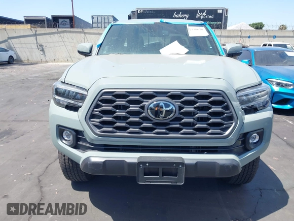 2023 Toyota Tacoma SR with VIN 3TMCZ5AN3PM590101, listed as a IAAI auction lot 42338670 with 12,970 mi miles and . Bid and sale history available at DreamBid. Image 12.
