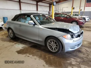 2011 BMW 1 Series 128i with VIN WBAUL7C57BVM80274, listed as a Copart auction lot 52127595 with 104,952 mi miles and Salvage title. Bid and sale history available at DreamBid. Image 4.