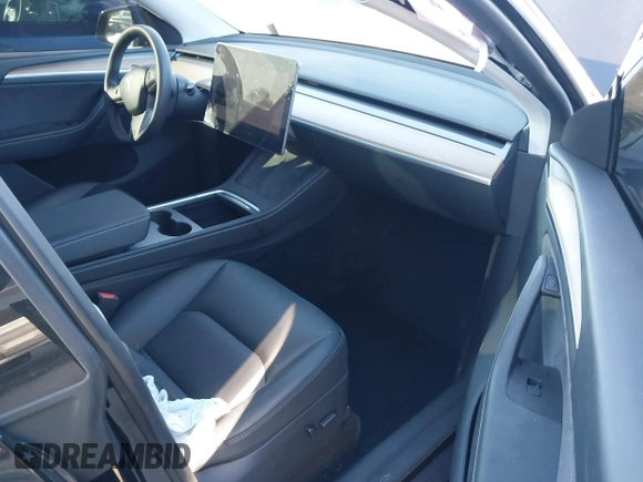 2024 Tesla Model Y Long Range with VIN 7SAYGDEEXRA216186, listed as a IAAI auction lot 41106653 with 25,331 mi miles and . Bid and sale history available at DreamBid. Image 5.