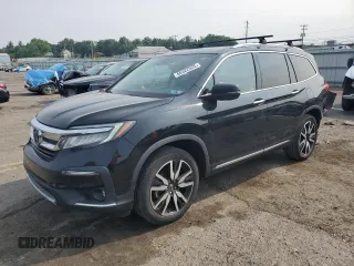 2019 Honda Pilot Touring 7-Passenger with VIN 5FNYF6H65KB095799, listed as a Copart auction lot 60322525 with 143,987 mi miles and Salvage title. Bid and sale history available at DreamBid. Image 1.