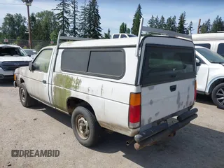 1987 Nissan Hardbody E z VIN JN6ND11S1HW047821, wystawiony jako IAAI lot #42210912 z przebiegiem 162 721 mil mil oraz . Historia ofert i sprzedaży dostępna na DreamBid. Obrazek 3.