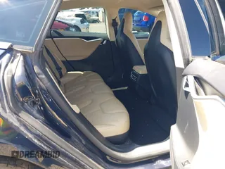 2014 Tesla Model S 60 with VIN 5YJSA1H18EFP31969, listed as a IAAI auction lot 42312485 with 90,043 mi miles and . Bid and sale history available at DreamBid. Image 8.