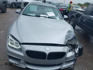 2015 BMW 6 Series 640i z VIN WBA6A0C51FD318982, wystawiony jako IAAI lot #41875547 z przebiegiem 60 968 mil mil oraz . Historia ofert i sprzedaży dostępna na DreamBid. Obrazek 20.