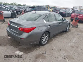 2015 Infiniti Q50 Premium z VIN JN1BV7AR9FM413801, wystawiony jako IAAI lot #42134770 z przebiegiem 111 367 mil mil oraz . Historia ofert i sprzedaży dostępna na DreamBid. Obrazek 4.