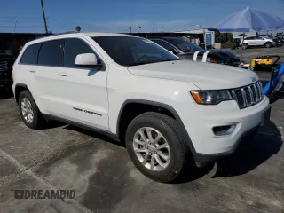 2021 Jeep Grand Cherokee Laredo E with VIN 1C4RJEAGXMC719497, listed as a Copart auction lot 60830315 with 3,873 mi miles and Salvage title. Bid and sale history available at DreamBid. Image 4.
