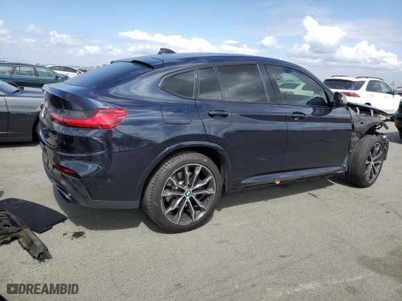 2020 BMW X4 M40i with VIN 5UX2V5C03LLE69705, listed as a Copart auction lot 71677404 with NaN miles and Salvage Title. Bid and sale history available at carsss.com. Image 3.