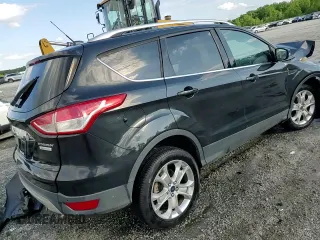 2015 Ford Escape Titanium with VIN 1FMCU0J96FUC59510, listed as a Copart auction lot 57091765 with 120,586 mi miles and Salvage title. Bid and sale history available at DreamBid. Image 14.