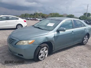 2007 Toyota Camry CE with VIN 4T1BE46K37U569515, listed as a IAAI auction lot 41974482 with 242,042 mi miles. Bid and sale history available at carsss.com. Image 6.