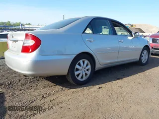 2003 Toyota Camry LE with VIN 4T1BE30K43U227357, listed as a IAAI auction lot 42144237 with 101,135 mi miles and . Bid and sale history available at DreamBid. Image 4.