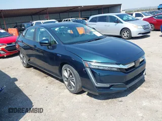 2018 Honda Clarity Touring z VIN JHMZC5F32JC001730, wystawiony jako IAAI lot #41718456 z przebiegiem 64 619 mil mil oraz . Historia ofert i sprzedaży dostępna na DreamBid. Obrazek 1.