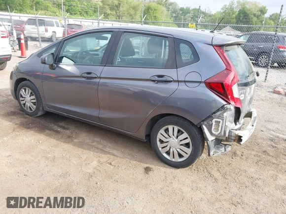 2015 Honda Fit LX with VIN 3HGGK5H58FM722880, listed as a IAAI auction lot 42276261 with 104,886 mi miles and . Bid and sale history available at DreamBid. Image 3.