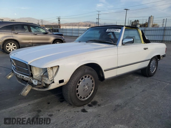 1989 Mercedes-Benz 560 Series 560SL with VIN WDBBA48D7KA100290, listed as a Copart auction lot 85049924 with 88,919 mi miles and Salvage Title. Bid and sale history available at carsss.com. Image 1.
