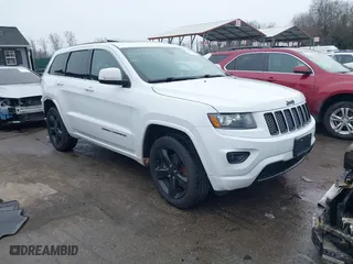 2015 Jeep Grand Cherokee Altitude with VIN 1C4RJFAG7FC954853, listed as a IAAI auction lot 40988796 with 107,002 mi miles. Bid and sale history available at carsss.com. Image 1.