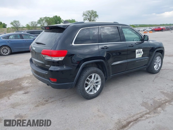 2018 Jeep Grand Cherokee Laredo E with VIN 1C4RJFAG6JC335606, listed as a IAAI auction lot 42280666 with 113,438 mi miles and . Bid and sale history available at DreamBid. Image 4.
