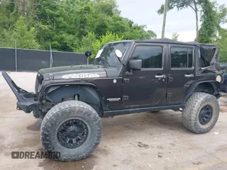 2013 Jeep Wrangler Unlimited Rubicon with VIN 1C4BJWFG5DL652050, listed as a IAAI auction lot 42451954 with 107,110 mi miles and . Bid and sale history available at DreamBid. Image 14.