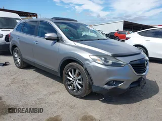 2014 Mazda CX-9 Grand Touring with VIN JM3TB2DVXE0432991, listed as a IAAI auction lot 42826784 with 134,265 mi miles and . Bid and sale history available at DreamBid. Image 1.