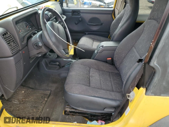 2001 Jeep Wrangler Sport z VIN 1J4FA49S01P355451, wystawiony jako Copart lot #56501545 z przebiegiem 213 027 mil mil oraz Czysty tytuł • Clean title. Historia ofert i sprzedaży dostępna na DreamBid. Obrazek 7.