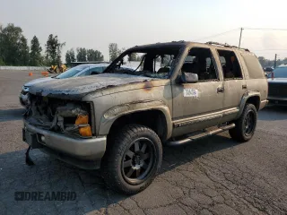 2000 Chevrolet Tahoe Z71 with VIN 1GNEK13R1YR182046, listed as a Copart auction lot 70364394 with Not provided miles and Salvage title. Bid and sale history available at DreamBid. Image 1.