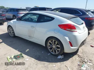 2013 Hyundai Veloster w/Black Int z VIN KMHTC6AD6DU107198, wystawiony jako IAAI lot #41983969 z przebiegiem 164 819 mil mil oraz . Historia ofert i sprzedaży dostępna na DreamBid. Obrazek 3.