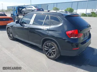 2015 BMW X1 sDrive28i with VIN WBAVM1C59FVW57928, listed as a IAAI auction lot 42056452 with 115,411 mi miles. Bid and sale history available at carsss.com. Image 3.