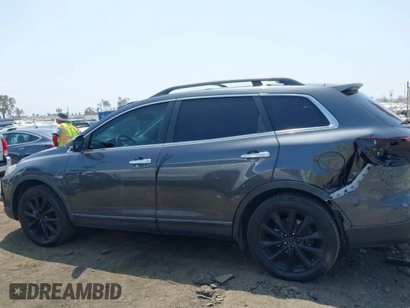 2015 Mazda CX-9 Grand Touring with VIN JM3TB3DA0F0459024, listed as a IAAI auction lot 42452288 with 174,716 mi miles and . Bid and sale history available at DreamBid. Image 14.