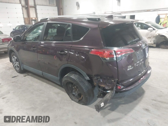 2018 Toyota RAV4 LE with VIN 2T3BFREV0JW759714, listed as a IAAI auction lot 41823084 with 119,909 mi miles and . Bid and sale history available at DreamBid. Image 3.