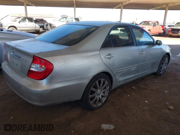 2003 Toyota Camry LE with VIN JTDBE32K730176610, listed as a IAAI auction lot 41627010 with 238,502 mi miles and . Bid and sale history available at DreamBid. Image 4.