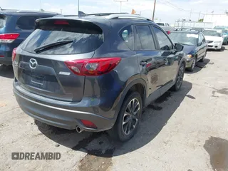 2016 Mazda CX-5 Grand Touring with VIN JM3KE4DY7G0643643, listed as a IAAI auction lot 42077497 with 120,343 mi miles and . Bid and sale history available at carsss.com. Image 4.