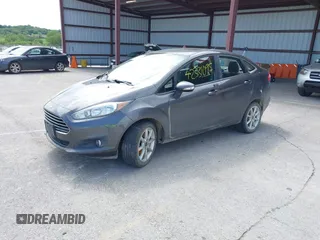 2017 Ford Fiesta SE z VIN 3FADP4BJ2HM134825, wystawiony jako IAAI lot #42331095 z przebiegiem 117 794 mil mil oraz . Historia ofert i sprzedaży dostępna na DreamBid. Obrazek 2.
